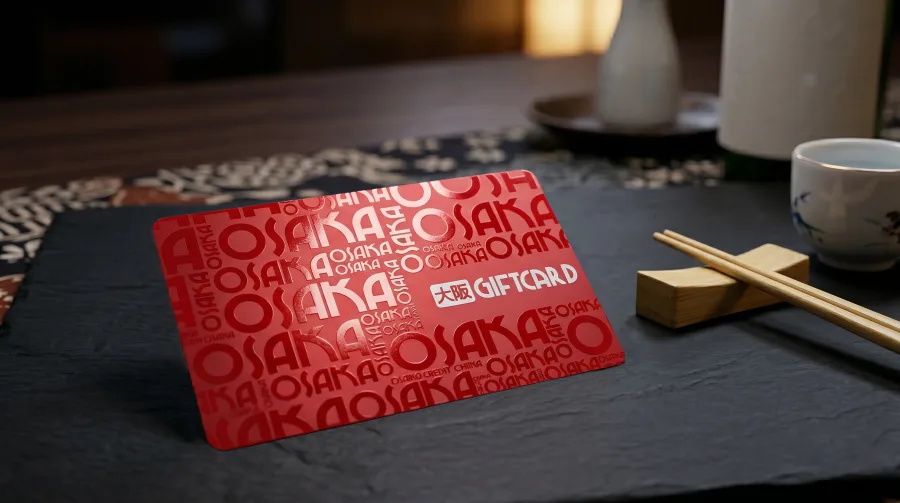 A silk-laminated 30mil plastic business card with a soft matte finish.